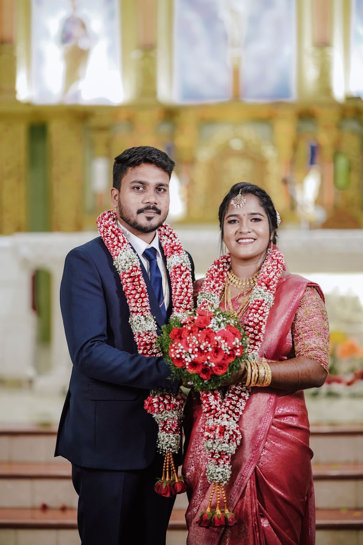 A couple in traditional Indian wedding attire