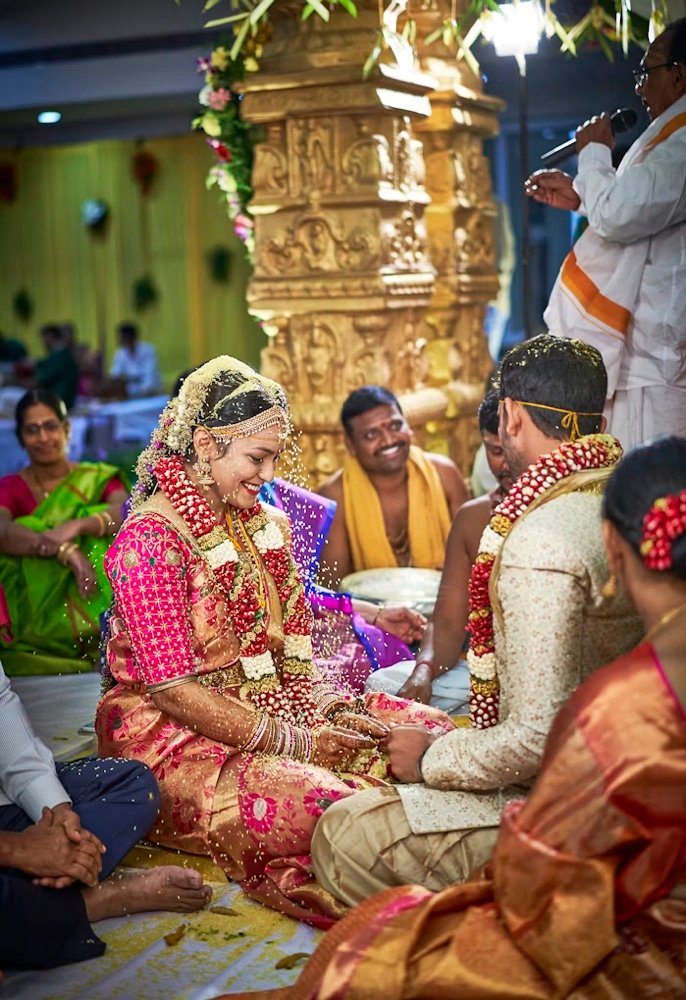 A bride and groom seated together at the wedding ceremony